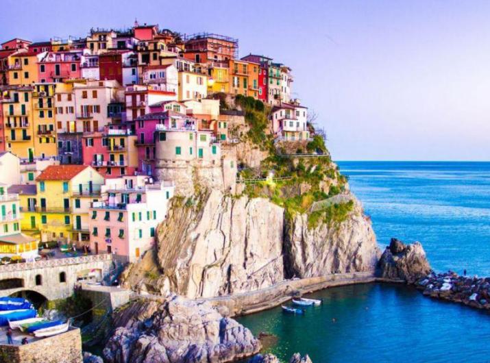 Colorful houses on a cliff by the sea.