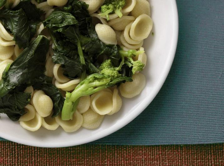 Orecchiette with broccoli rabe on a white plate.