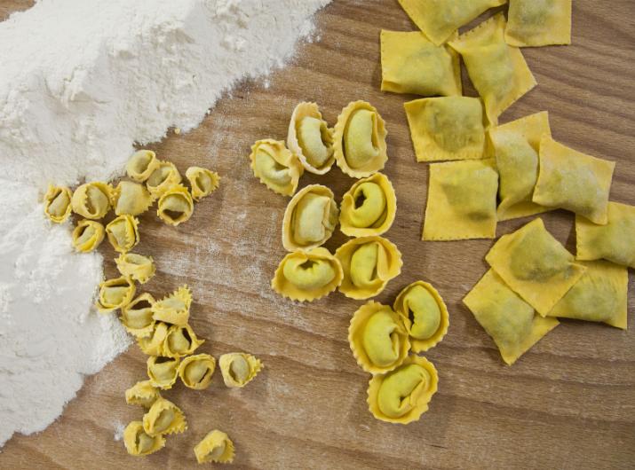 Handmade fresh pasta: tortellini, ravioli, and flour.